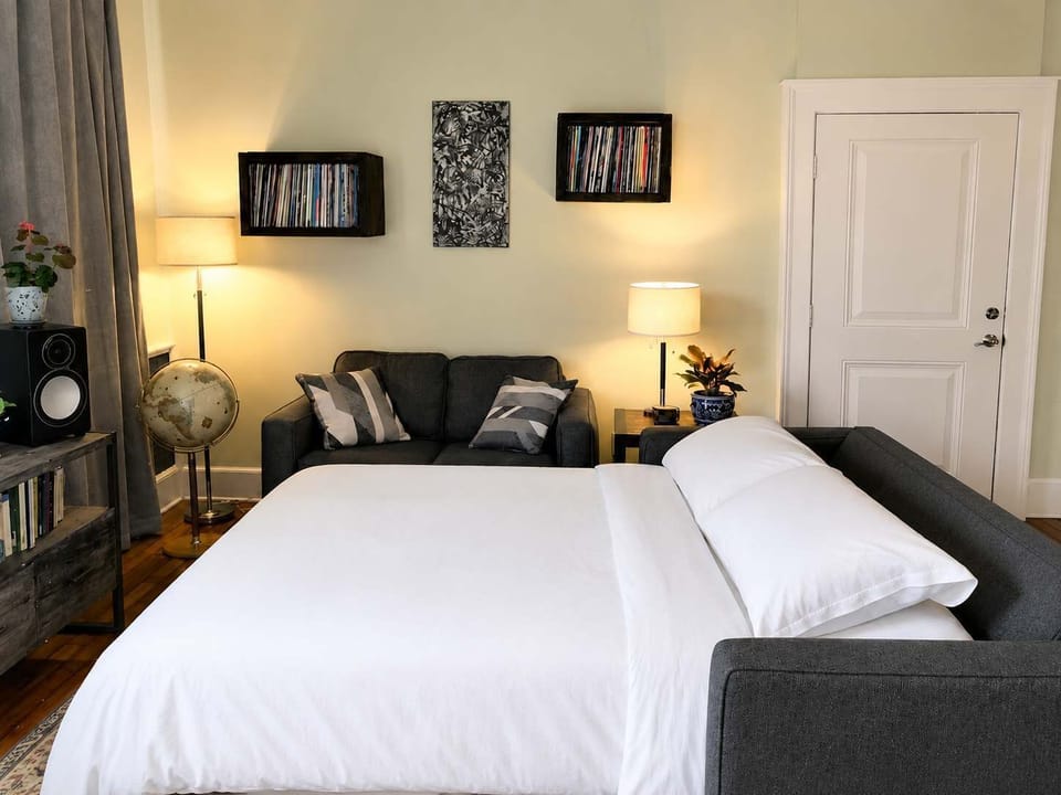 Living room space with Queen pullout sofa bed 