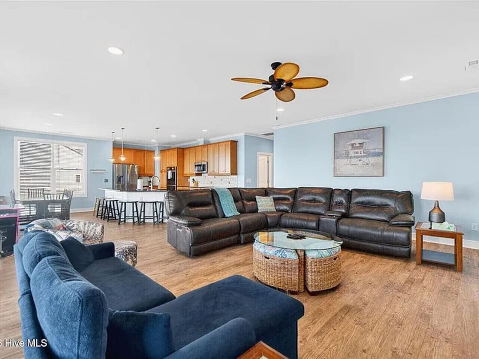 spacious living room with a sleeper sofa and spacious kitchen