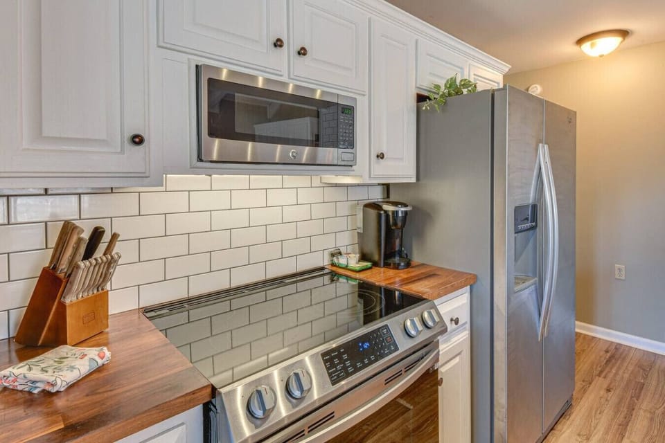Modern stainless steel appliances--electric range, full-size fridge, mircowave, dishwasher, and Keriug coffee for your morning pleasure