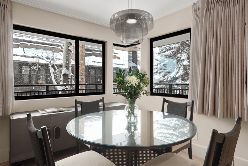 Gorgeous dining area surrounded by windows