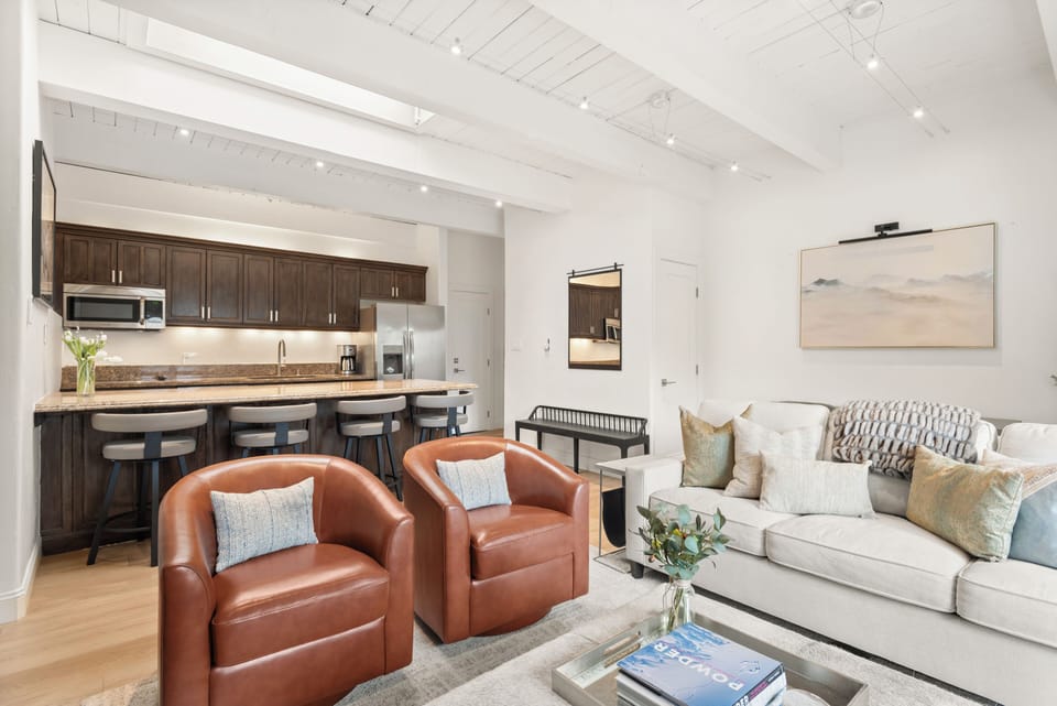 Open-concept kitchen and living space with expansive views.