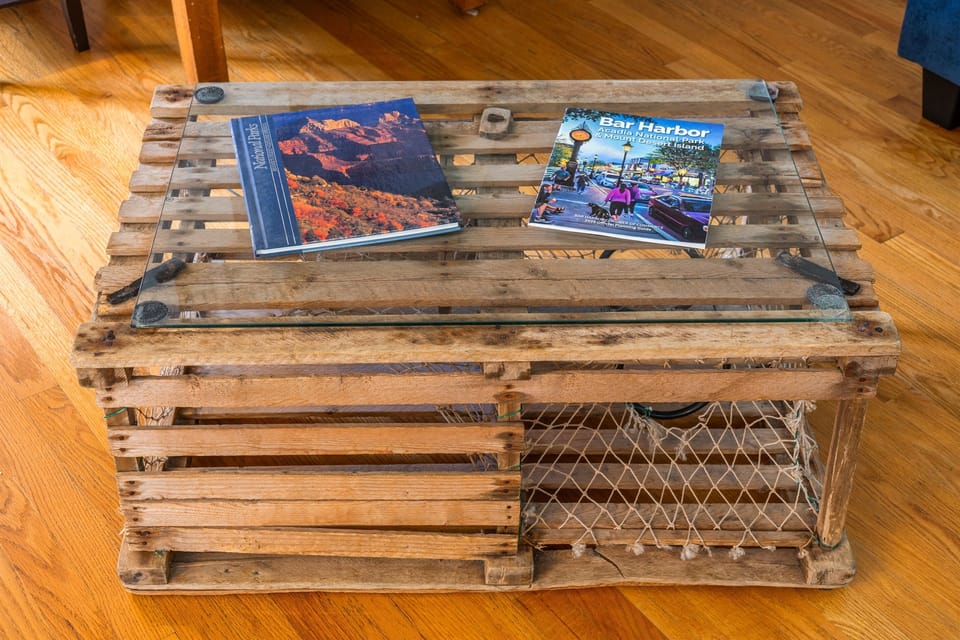 An Instagram-ready Maine original. This custom lobster trap coffee table is a true conversation piece in our 1880 living room. Browse our provided Acadia and Bar Harbor books while relaxing at your authentic Hall Quarry Quiet Side basecamp.