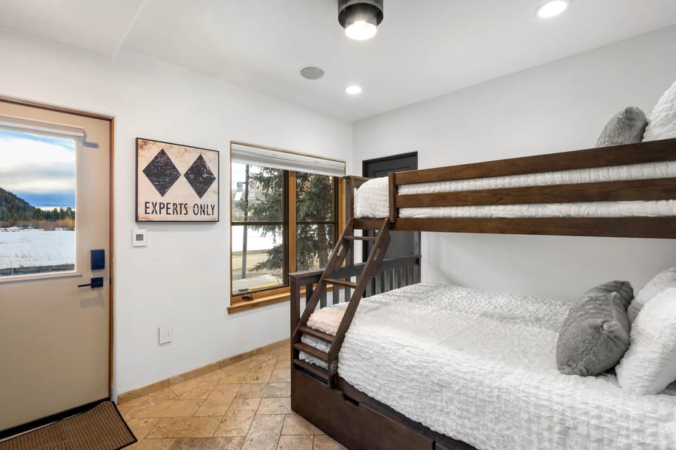 Guest Bedroom with a queen/twin bunkbed, private entrance, and ensuite bath