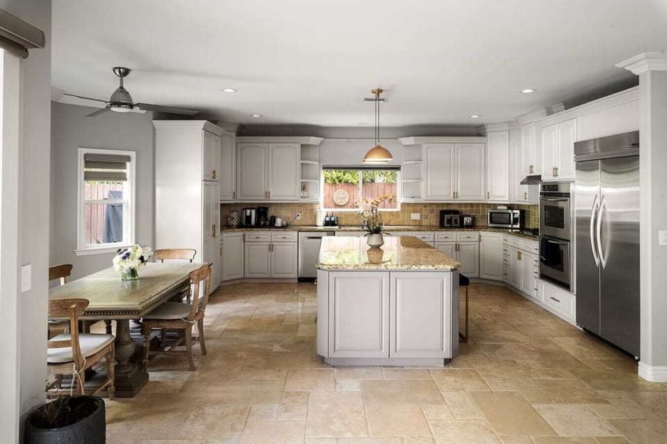 Spacious and inviting kitchen with easy access to the living and sitting areas.