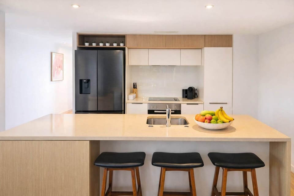 Whip up your favourite meals in the stylish modern kitchen, fully equipped with quality appliances, a breakfast bar, and all the essentials for a comfortable stay