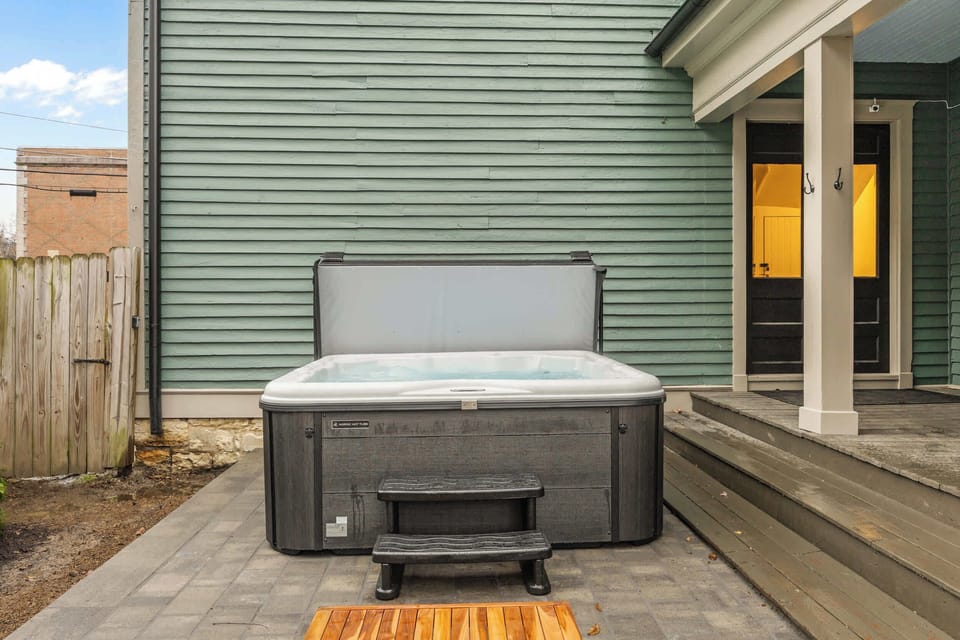 Backyard: After a day of adventures, gather your crew in this private backyard oasis. Soak your cares away in the large, modern hot tub while others relax and chat on the stylish patio seating just steps away. 