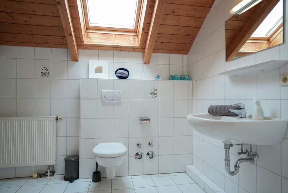 Modern bathroom with stylish accents and natural light.
