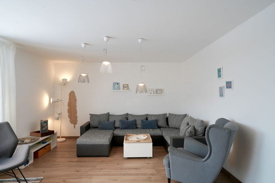 Cozy Living Room with Sofa and Modern Lamps