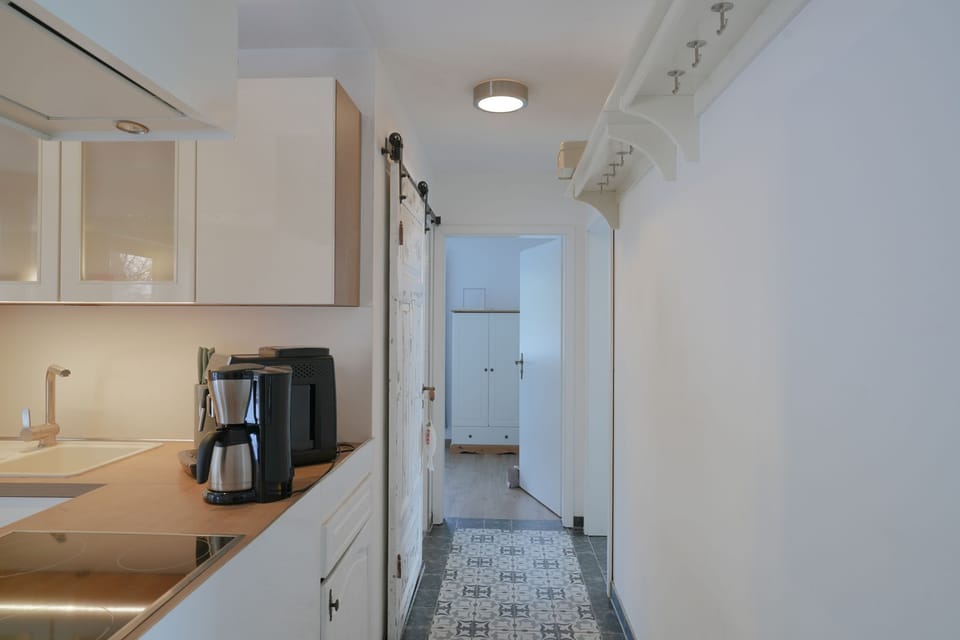 Bright kitchen with modern cabinets and coffee maker
