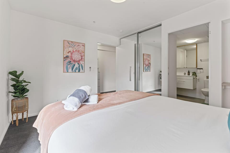 A view of the master bedroom from another angle so yo can see the overall shape and dimensions of the room and the wonderful painting we have on the wall! 