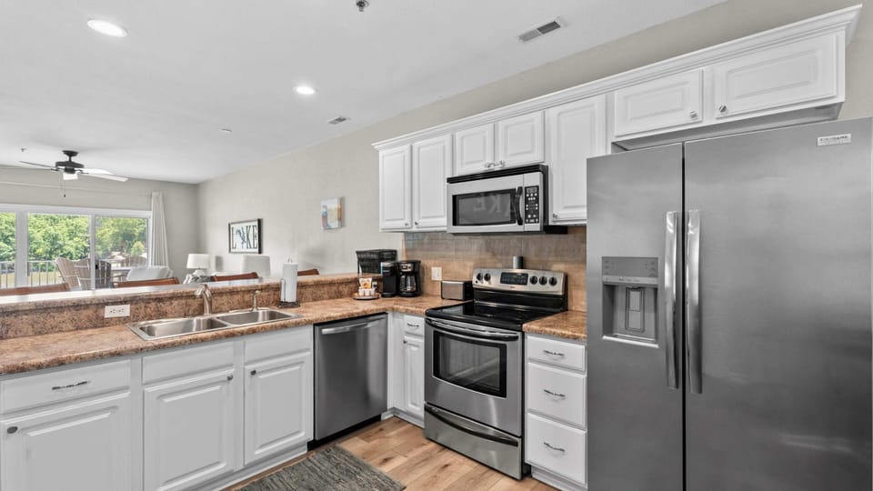 The open kitchen offers ample space & all the comforts of home​