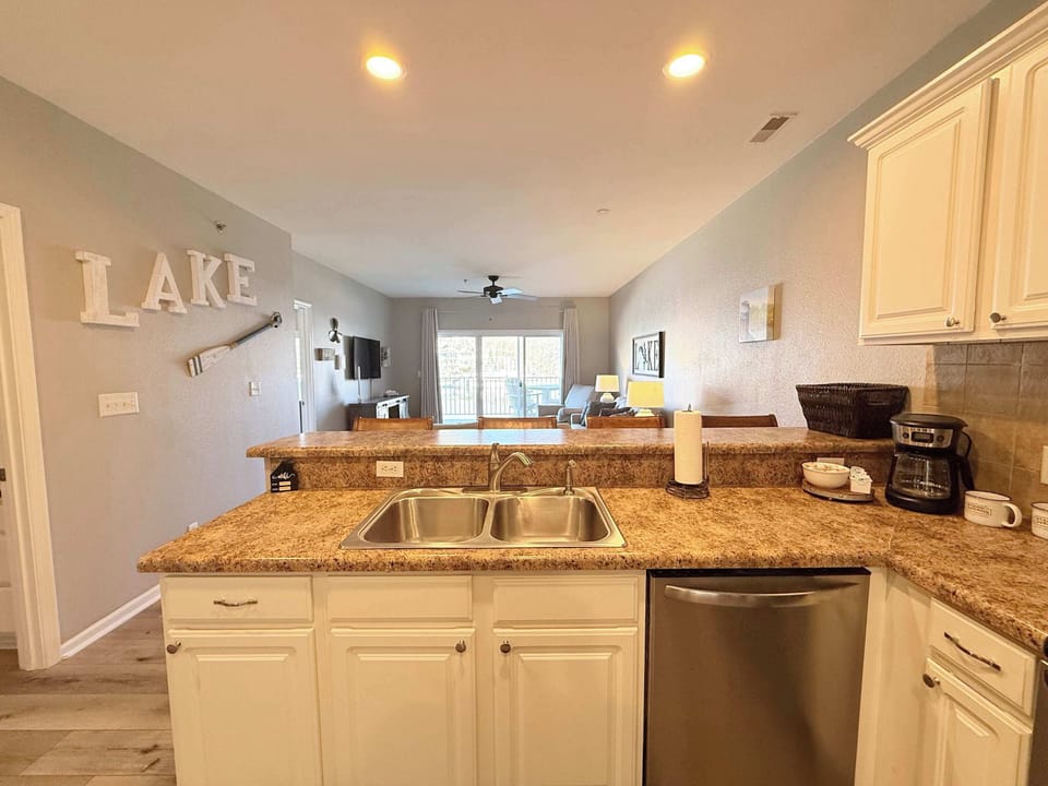 The open kitchen offers ample space & all the comforts of home​