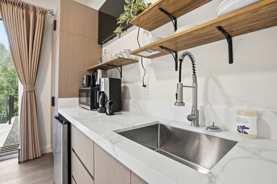 Full size sink and kitchen.