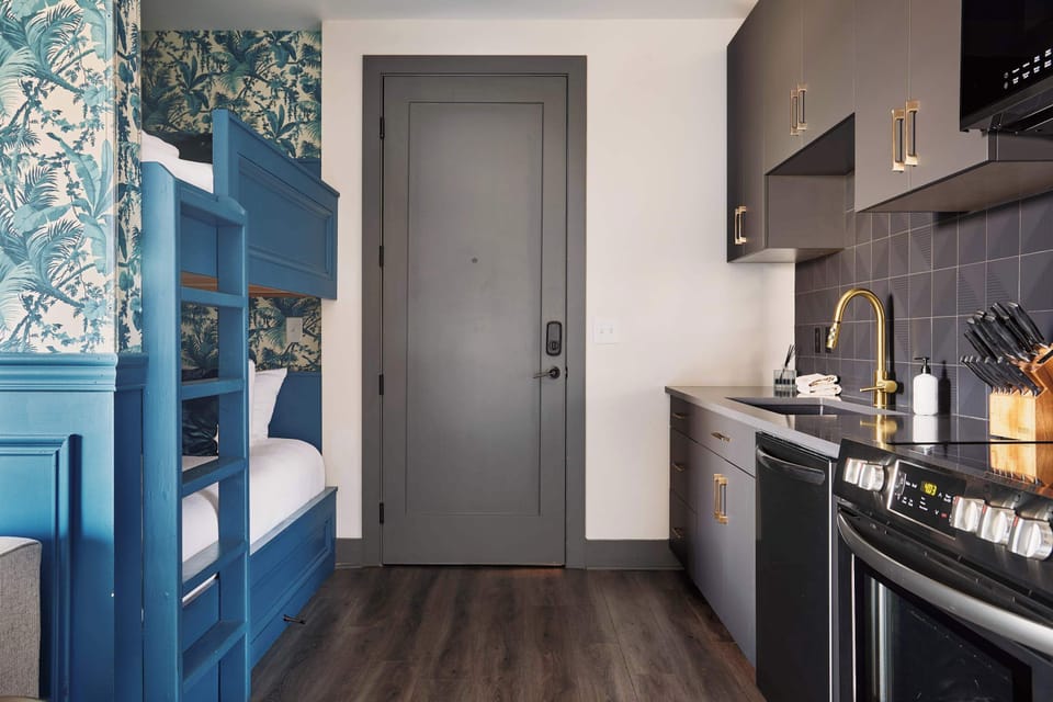 Thoughtfully designed for both comfort and functionality, this space blends a modern kitchen with charming built-in bunks for a stay that feels effortless.