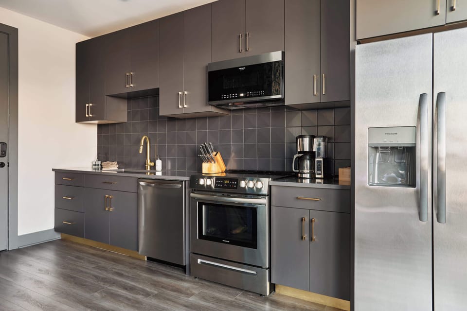 A sleek kitchen with modern appliances and everything you need to cook, sip, and settle in with ease.