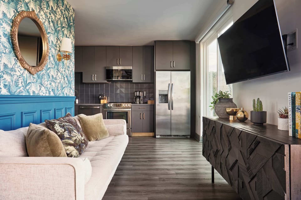 This open-concept living area blends comfort and character, giving you the perfect spot to relax, cook, and feel completely at home.