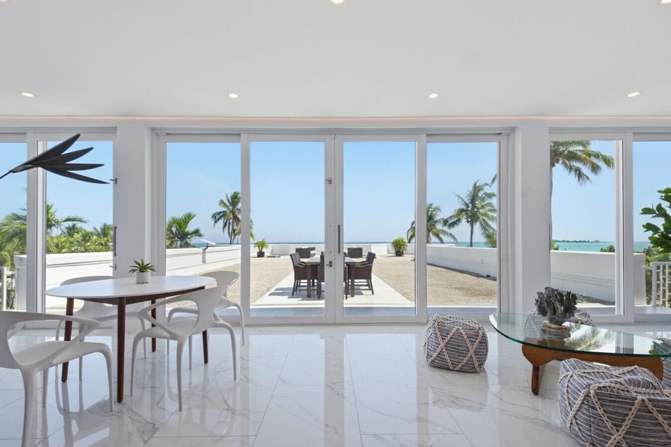 Laid-back luxury meets coastal comfort in this sleek, open-concept design, boasting an spectacular 3,400 sq. ft. terrace directly on the ocean.