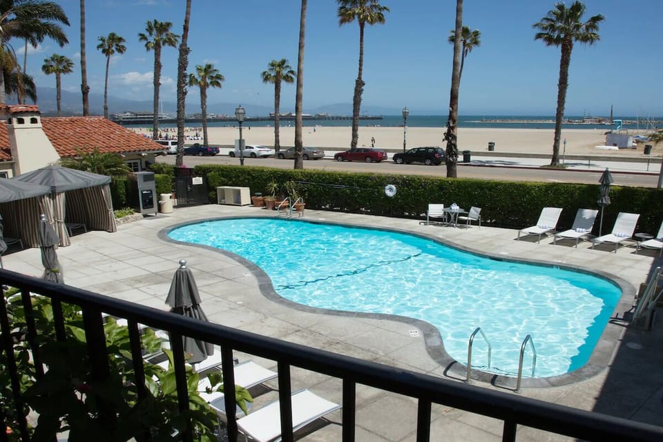 Dive into sparkling pool days with ocean breezes nearby.