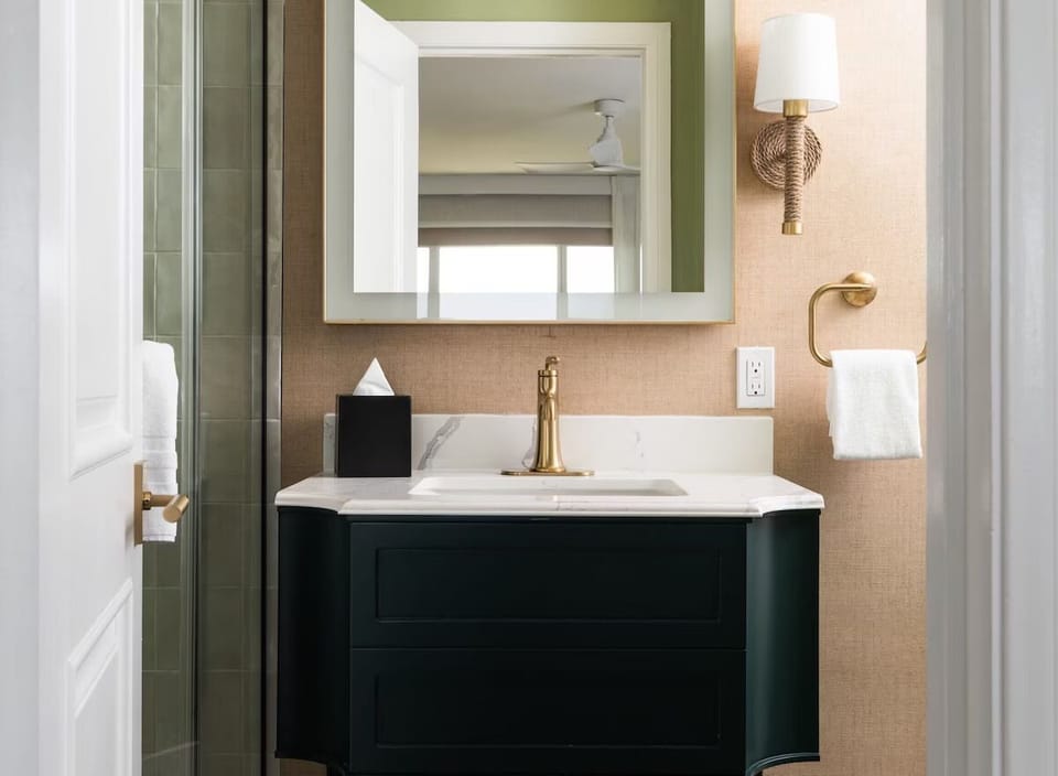 Refresh at a stylish vanity with soft, flattering light.