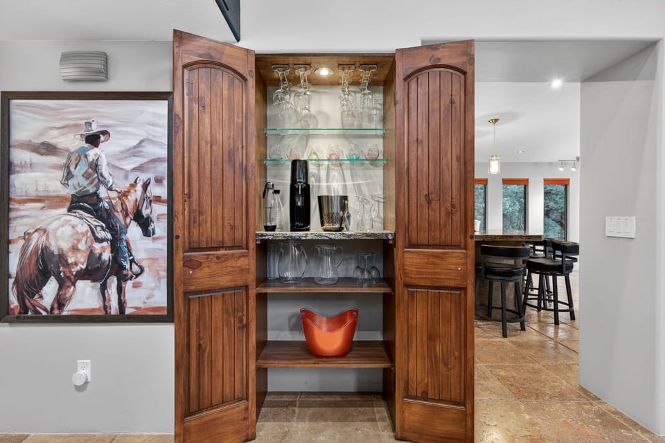 Wall bar cabinet with glassware for the group