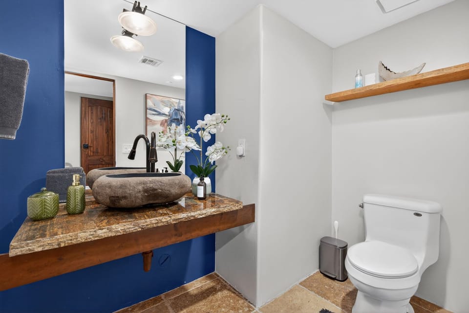 Lower Hall half bath right below stairwell