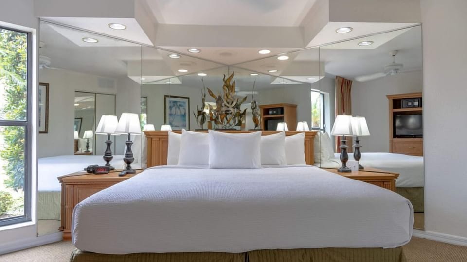 Unwind in a serene bedroom with crisp linens and soft lighting