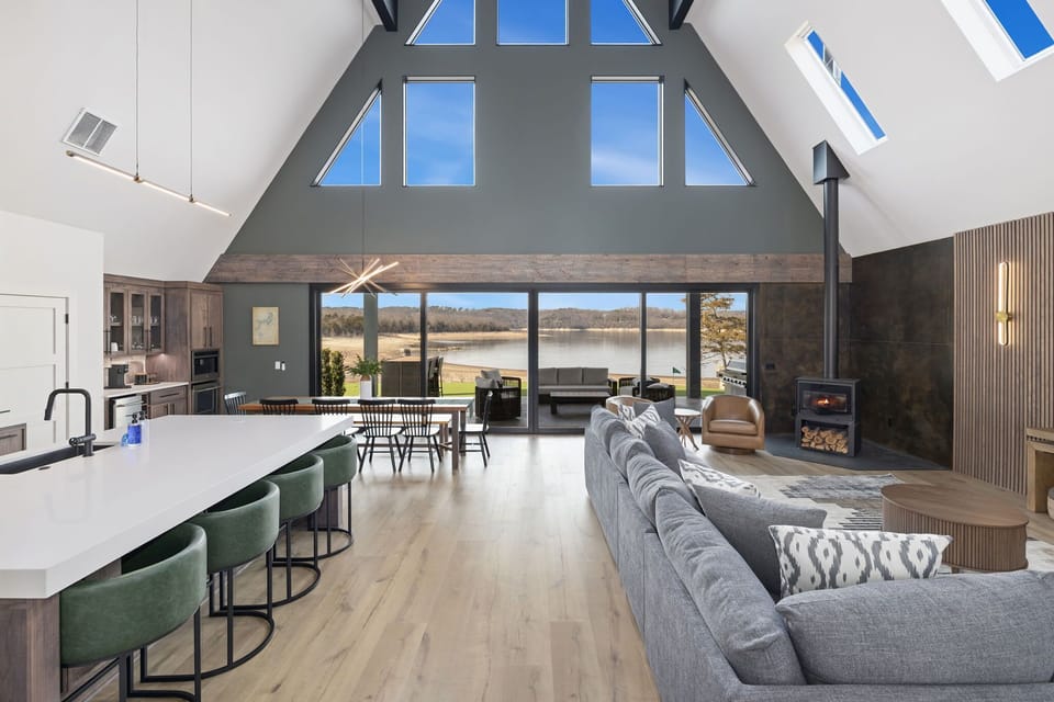 Inside you'll love the open concept living space and kitchen area in the center of the A Frame. This is entire space is flooded with natural light and boasts gorgeous views of Beaver Lake.stunning water views.