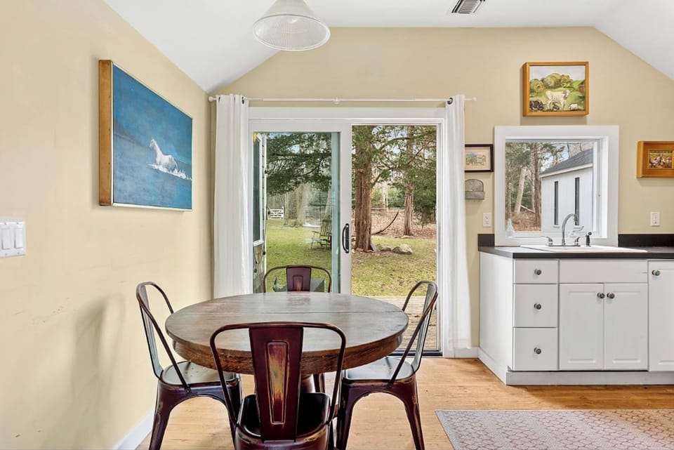 Enjoy meals with a view—bright dining area opening up to the gardens.
