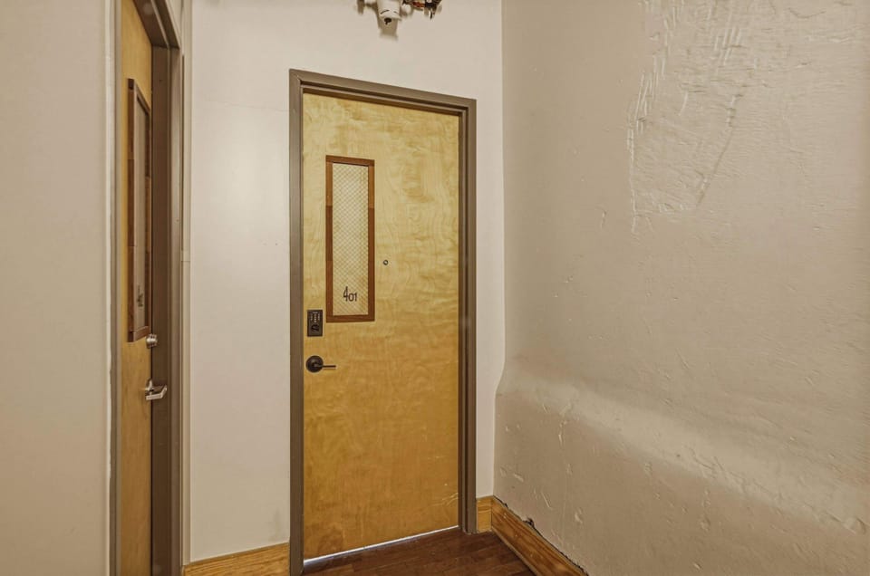Light-filled and thoughtfully composed, this twin room blends industrial character with soft, modern comfort.