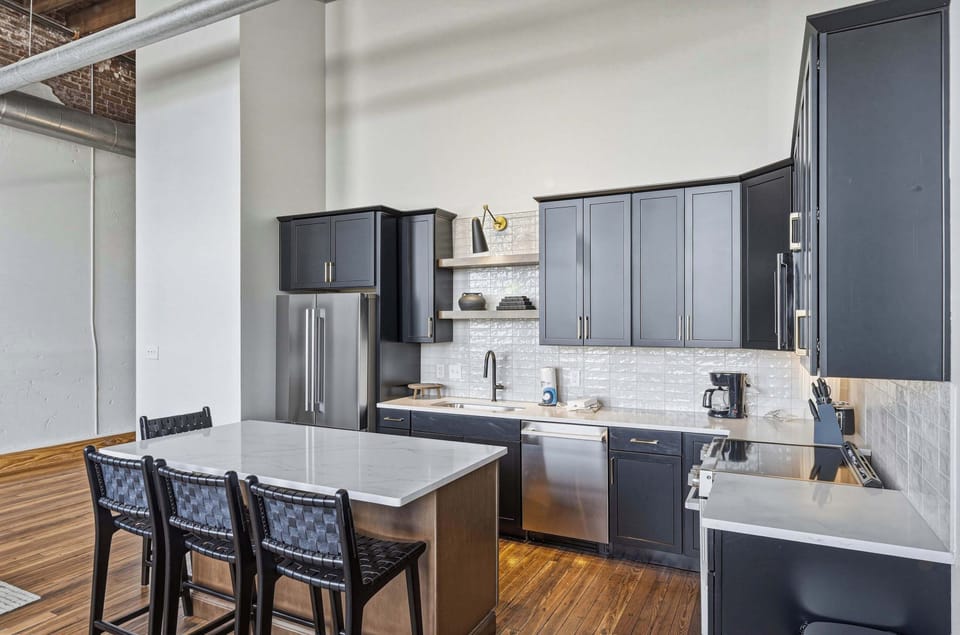 Enjoy a spacious island with bar seating, modern appliances, and everything you need to prepare meals at home.