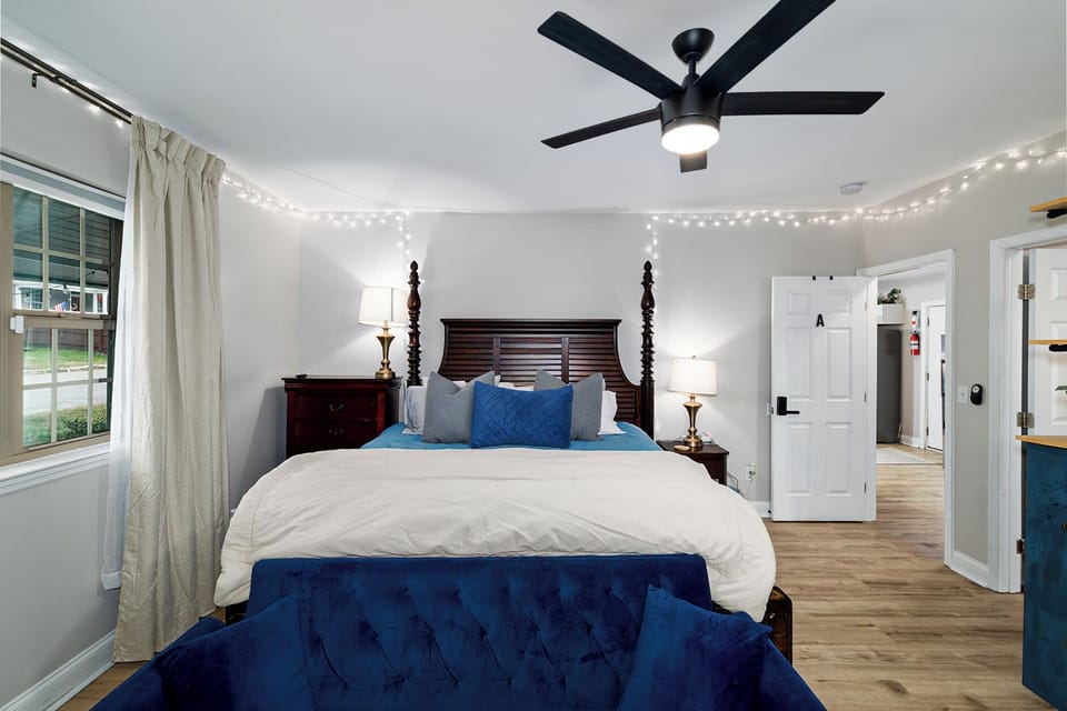 Master bedroom with attached bath, king bed, and work space