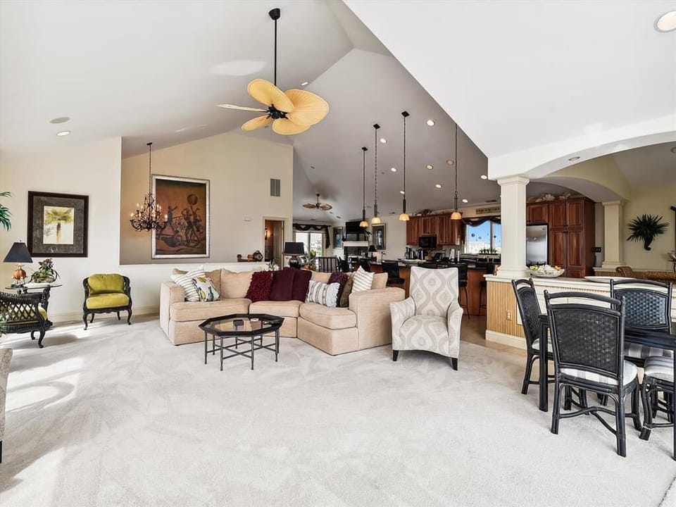 The open-concept design features vaulted ceilings and stylish furnishings, creating a warm, inviting atmosphere perfect for relaxation and entertaining.