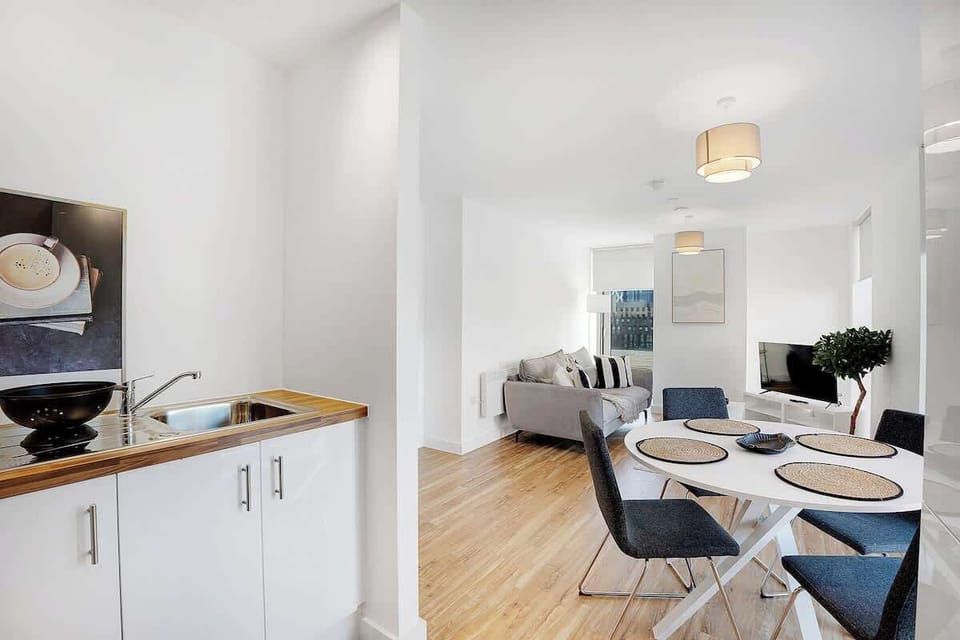 Kitchen equipped with all essentials, including a washer & dryer, oven, fridge and full cookware set.