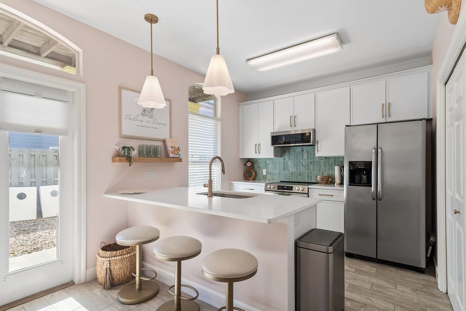 Cook delicious meals in the Fully-stocked, Remodeled Kitchen with new quartz countertops and all new stainless appliances