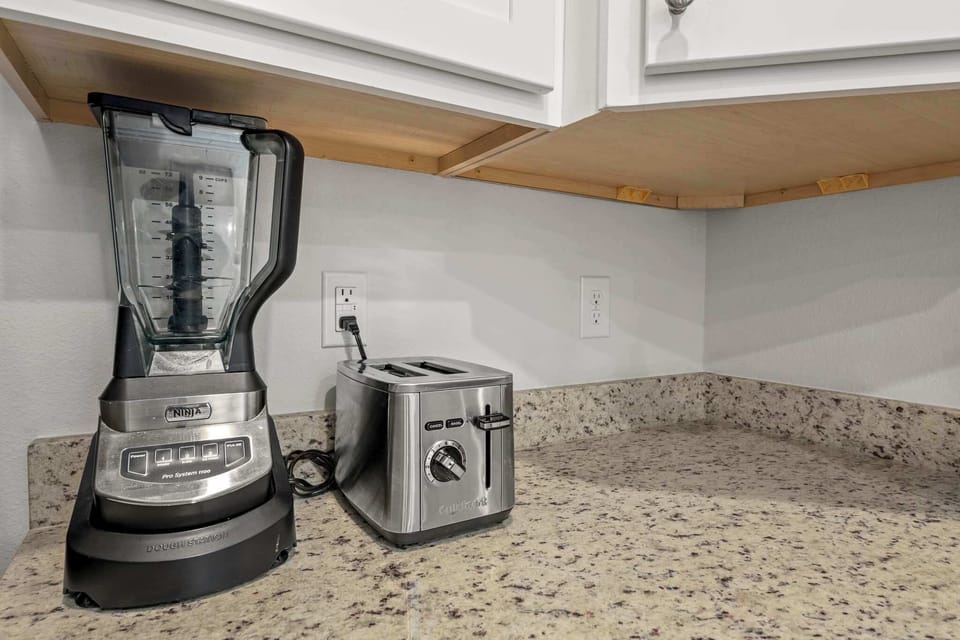 We've stocked this kitchen with full appliances, dishes, bake ware, pots & pans, silverware, utensils, crockpot, a blender, and more!