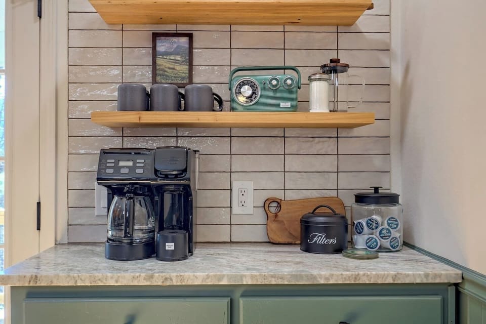 Upstairs kitchen coffee bar with coffee maker that brews both full pots and single-serve pods — perfect for slow mountain mornings ☕