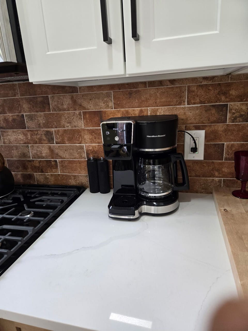 Kitchen - Multiple cup or single cup coffee maker with coffee.