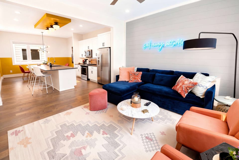 Open kitchen-to-living sight lines keep the house tight and connected, perfect for a group getaway where nobody gets left out of the action