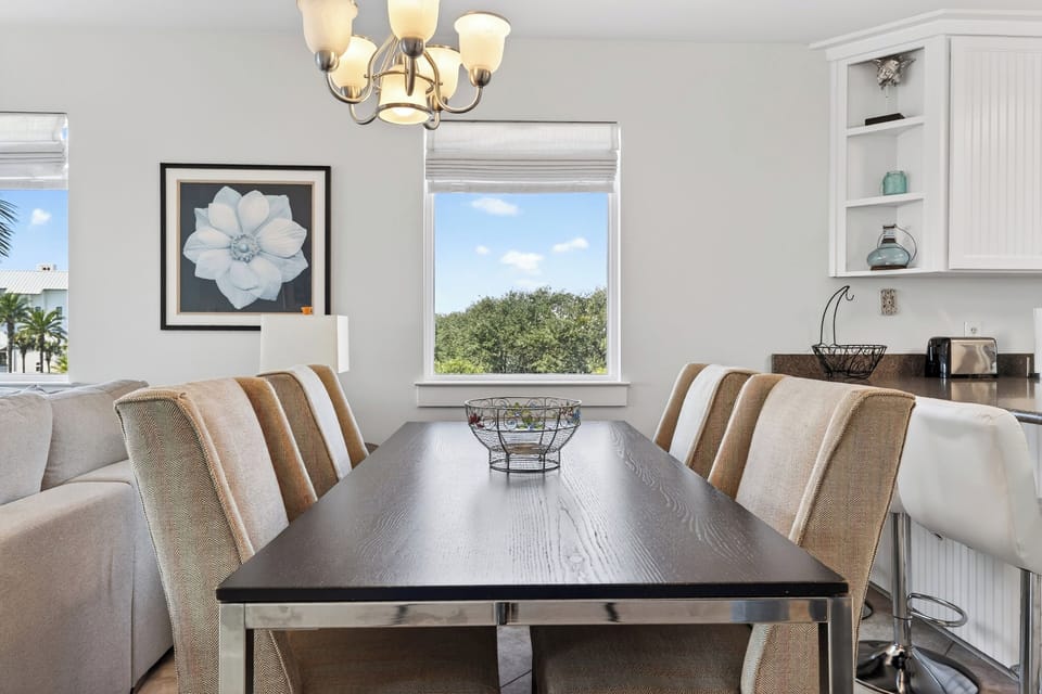 Gather for meals and game nights at the spacious dining table—steps from the kitchen for easy serving.