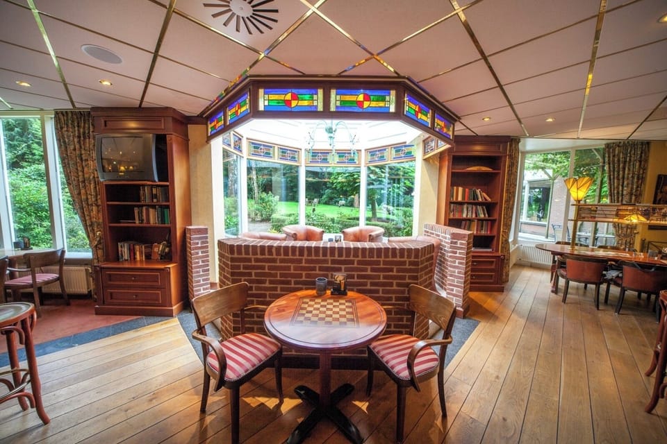 Unwind by stained-glass windows in a warm, inviting lounge.