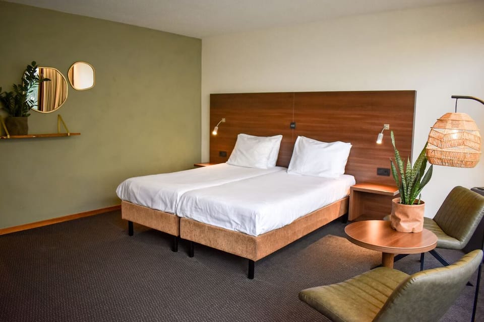 Unwind in crisp linens and warm, modern hotel style.