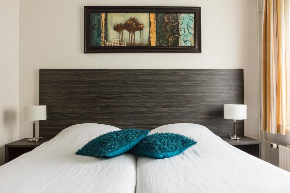 Unwind in a serene bedroom with soft lighting.