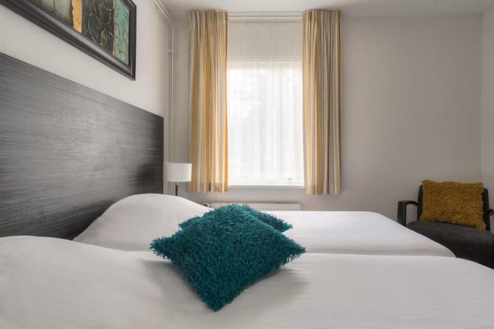 Sink into crisp twin beds after a day exploring.