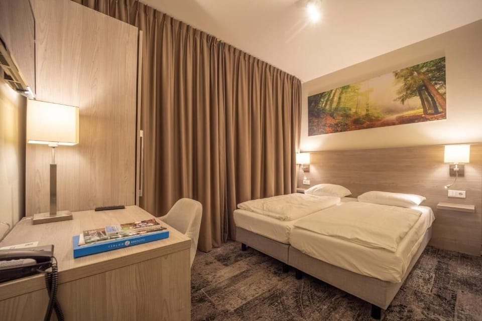 Unit with single beds. Exact unit will be assigned upon arrival. Views, colors, and decor may vary.