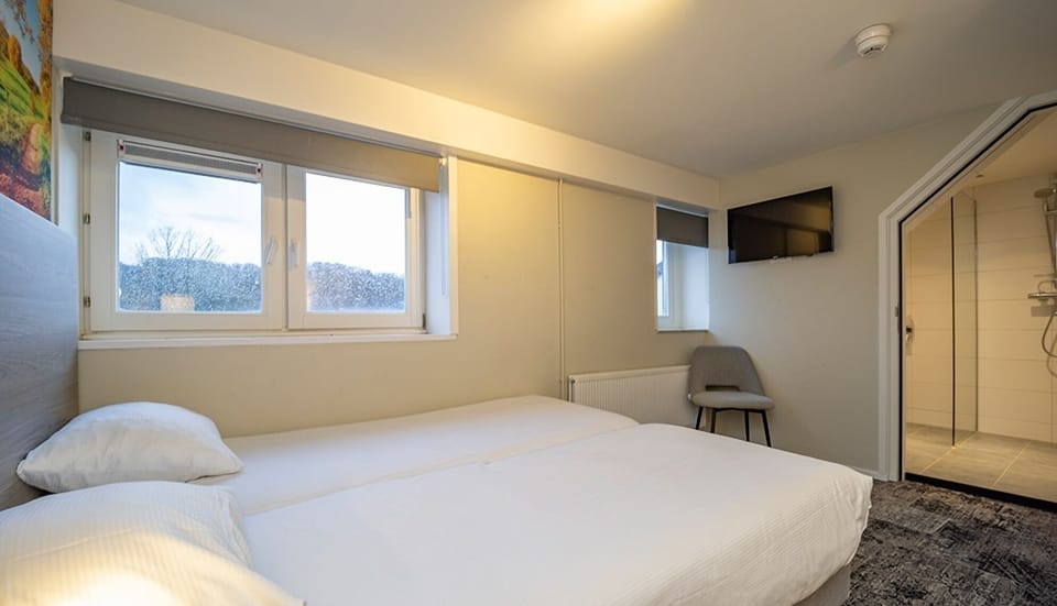 Unit with 3 Single Beds. Exact unit will be assigned upon arrival. Views, colors, and decor may vary.