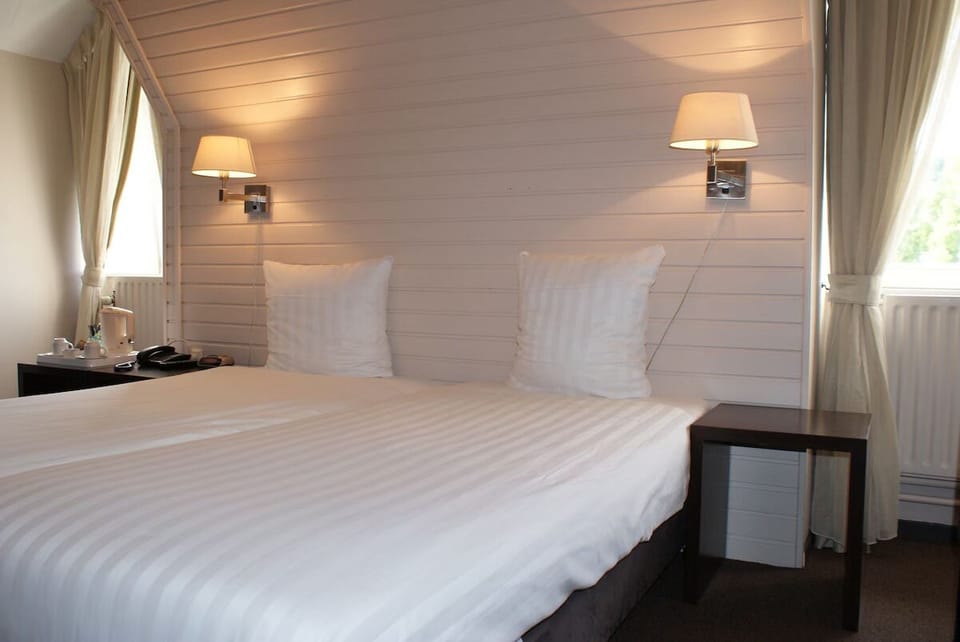 Unit with 2 Single Beds. Exact unit will be assigned upon arrival. Views, colors, and decor may vary.