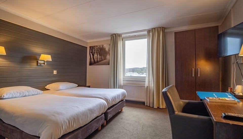 Unit with 2 Single Beds. Exact unit will be assigned upon arrival. Views, colors, and decor may vary.