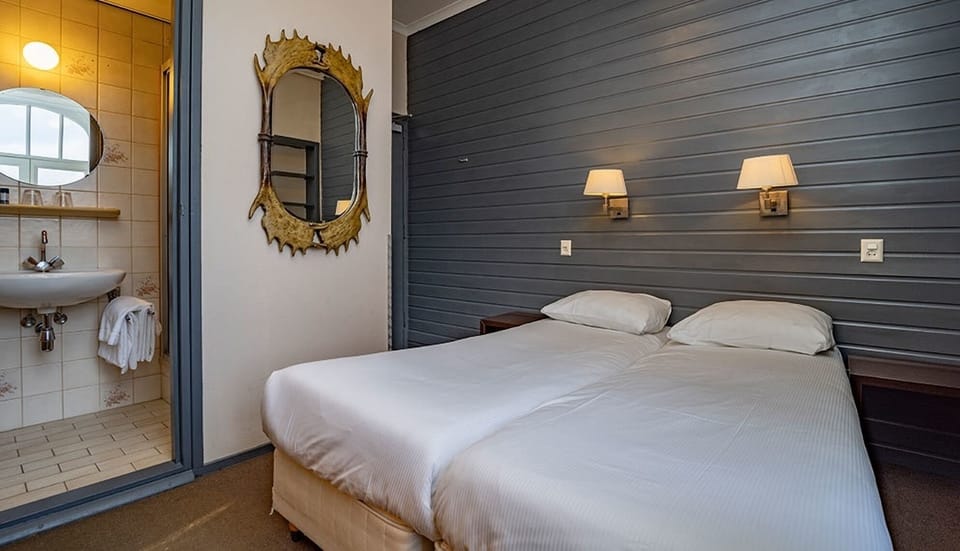 Unit with 2 Single Beds. Exact unit will be assigned upon arrival. Views, colors, and decor may vary.