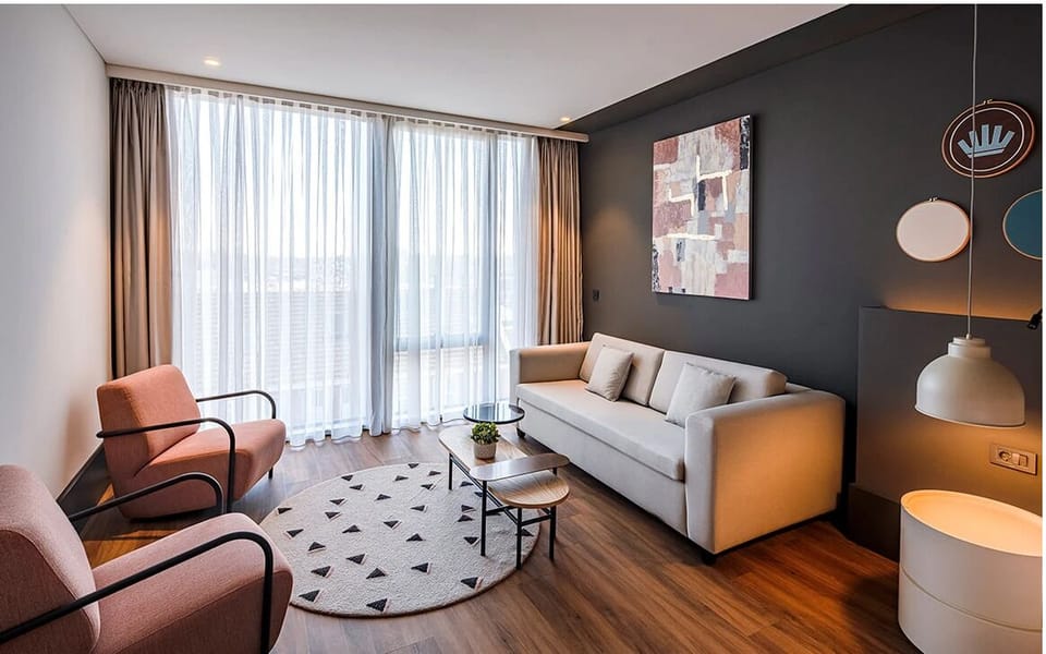 Unwind on the cozy sofa with calming daylight views.