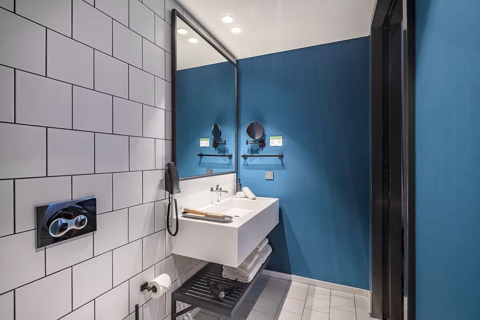 Ease into your routine with roomy vanity and bright mirror light.